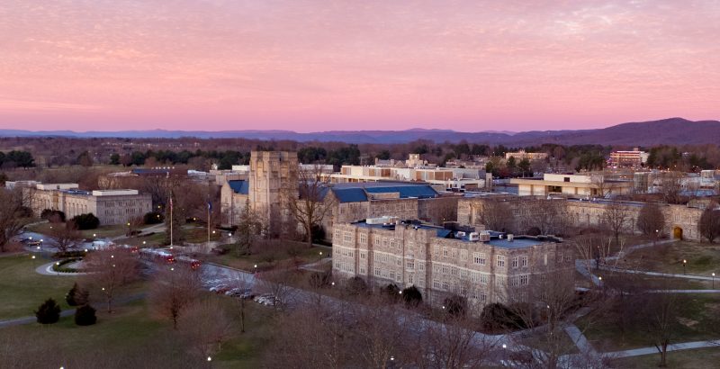 Aerial sunrise view of Burruss Hall and surrounding buildings