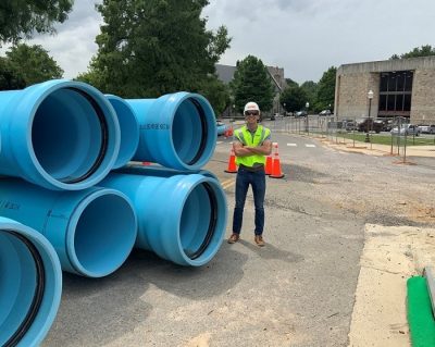 Pipes for chilled water infrastructure project - scale with man standing next to it