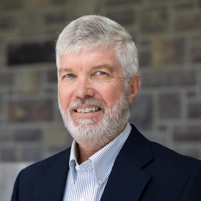 A 1x1 portrait of Todd Shelton against a Hokie Stone background