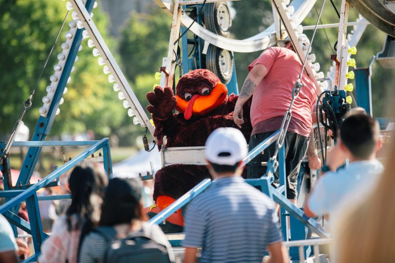 Hokiebird is on the Ferris wheel at GobblerFest and is ready to go for a fun ride.