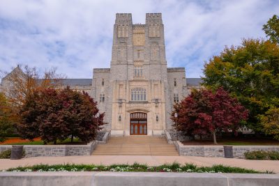Exterior of the front of Burruss Hall on a fall day.