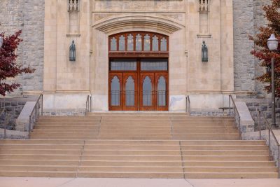 Burruss Hall featuring front doors and staircase.  